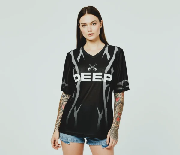 orchid-jersey-front-burn Female model in black Orchid Jersey front view, women’s sportswear top.