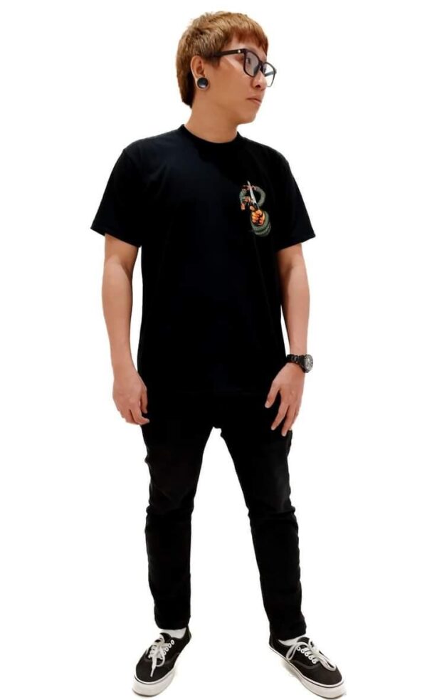 Male model wearing a black ‘HABITS’ t-shirt from Dig Deep.