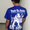 Male model wearing Demolition Dept. graphic T-shirt, back view.