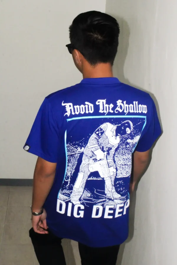 Male model wearing Demolition Dept. graphic T-shirt, back view.