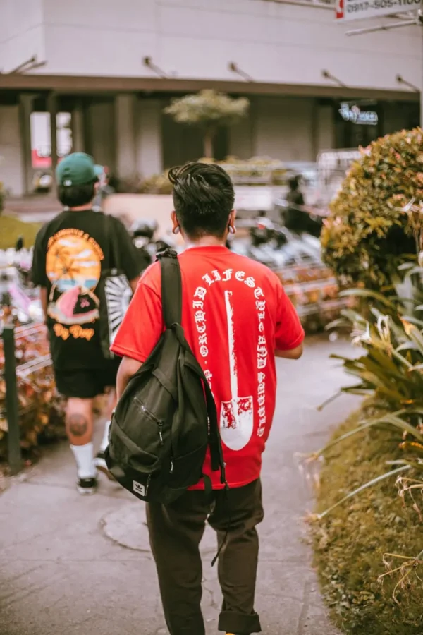 Male model in red Mucky Shovel streetwear T-shirt