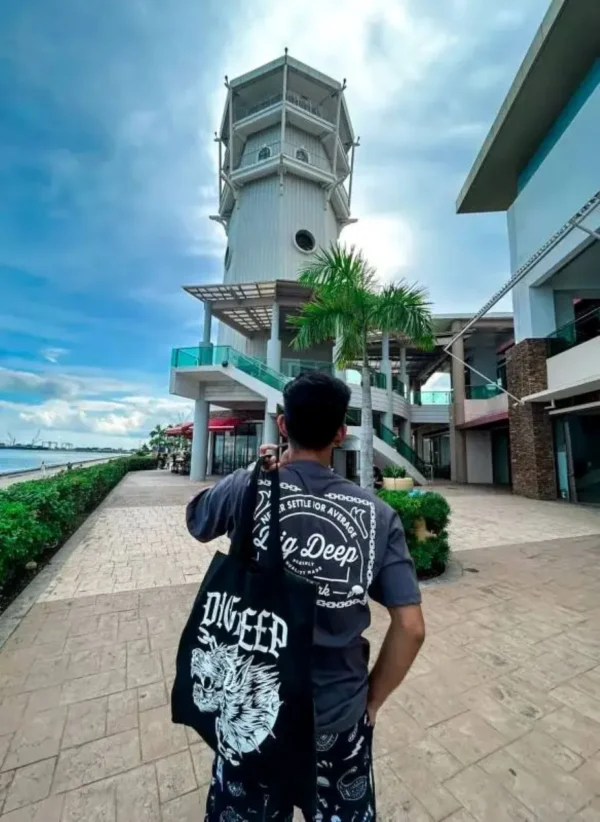 Dig Deep tote bag male model.